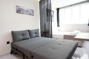 Posteľ alebo postele v izbe v ubytovaní SKG Luxury Apartment