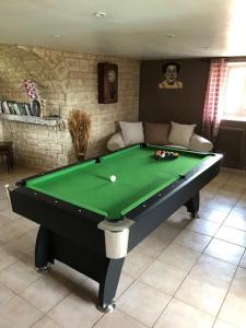 a green pool table in a living room at EI Domaine du Bouygues chambres d'hôtes in Le Juge