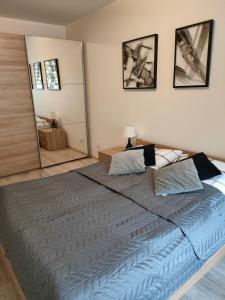 Posteľ alebo postele v izbe v ubytovaní Apartament Maja Zielone Tarasy Kołobrzeg