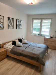 Posteľ alebo postele v izbe v ubytovaní Apartament Maja Zielone Tarasy Kołobrzeg