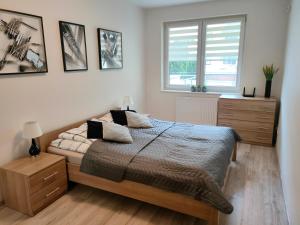 Posteľ alebo postele v izbe v ubytovaní Apartament Maja Zielone Tarasy Kołobrzeg