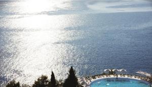 a view of a swimming pool in the ocean at Sun Gardens Dubrovnik in Dubrovnik