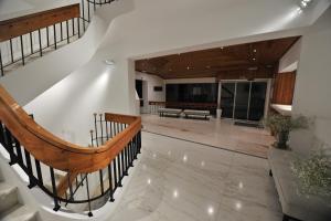 a staircase in a house with a living room at Hotel Búzio in Sines