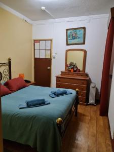 a bedroom with a bed and a dresser and a mirror at Pensao Residencial Flor dos Cavaleiros in Lisbon +60 photos