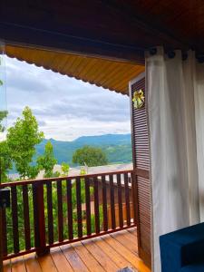 a balcony with a view of the mountains at Cabana Alto do Monte in Gramado