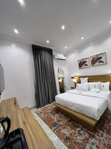 A bed or beds in a room at Bricks Residence