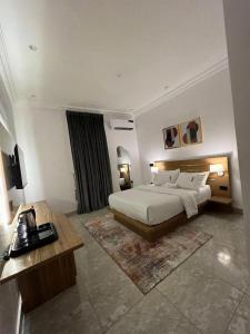 A bed or beds in a room at Bricks Residence