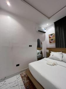 A bed or beds in a room at Bricks Residence