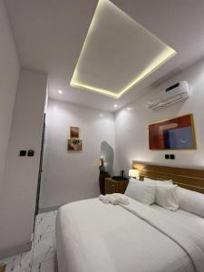 A bed or beds in a room at Bricks Residence