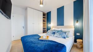 Postel nebo postele na pokoji v ubytování Apartament Lux Tukan B003, Polanki Aqua - Holiday City