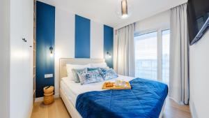 Postel nebo postele na pokoji v ubytování Apartament Lux Tukan B003, Polanki Aqua - Holiday City