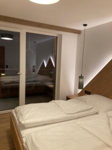 Letto o letti in una camera di das MARX - Gasthof Marx - Apartments