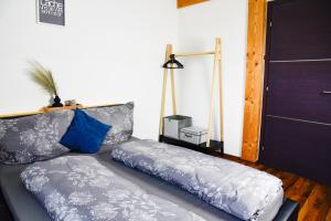 a couch with pillows sitting in a living room at Ferienhaus Oberhof in Weissenbach am Lech