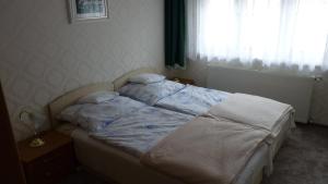 Posteľ alebo postele v izbe v ubytovaní Somogyi Apartmanház + 5 fotografií