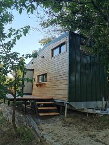 a tiny house sitting on top of a tree at Tiny House in Garden with Sea View in Karamusal