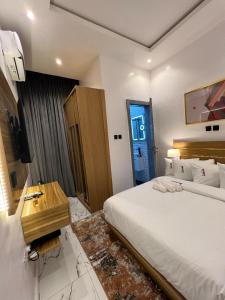 A bed or beds in a room at Bricks Residence