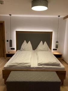 Letto o letti in una camera di das MARX - Gasthof Marx - Apartments