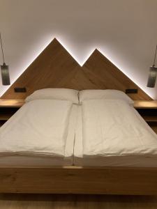 Letto o letti in una camera di das MARX - Gasthof Marx - Apartments
