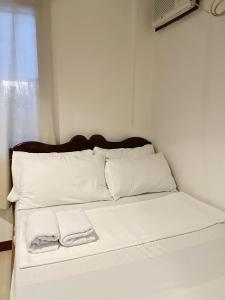 Postel nebo postele na pokoji v ubytování Lara's Guesthouse Siargao
