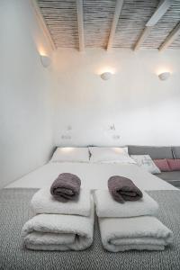 A bed or beds in a room at Serifos Sugar Cubes