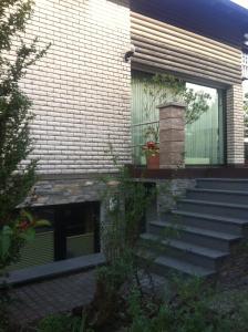 a house with stairs leading up to a window at Appartement Ursula Eck in Bergisch Gladbach