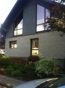 a house with windows on the side of it at Appartement Ursula Eck in Bergisch Gladbach