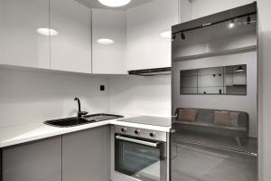 Kuchyňa alebo kuchynka v ubytovaní MyPLACE Premium Apartments + 7 fotografií