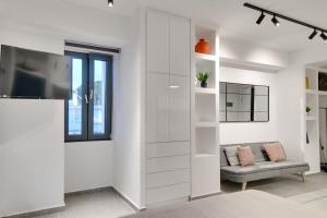 Televízia a/alebo spoločenská miestnosť v ubytovaní MyPLACE Premium Apartments