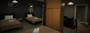 Postel nebo postele na pokoji v ubytování Hotel Ambasador