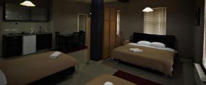 Postel nebo postele na pokoji v ubytování Hotel Ambasador