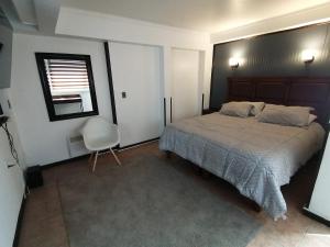 Postel nebo postele na pokoji v ubytování Hostal Santa