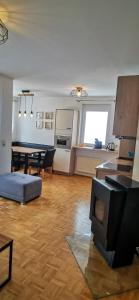 a living room with a table and a dining room at Apartments Bergblick in Sonnenalpe Nassfeld