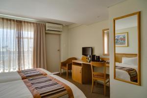 Кровать или кровати в номере River City Inn