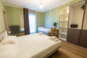 Ένα ή περισσότερα κρεβάτια σε δωμάτιο στο Hotel Casa Alpina