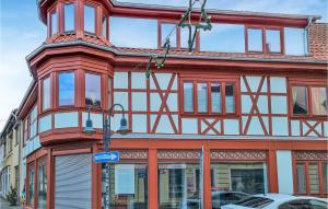 a red and white building with a lot of windows at 2 Bedroom Cozy Apartment In Kltze in Klötze