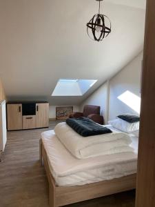 Posteľ alebo postele v izbe v ubytovaní Le Martin Pêcheur - Appartement