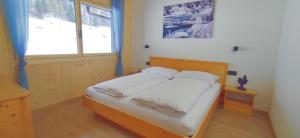 Ένα ή περισσότερα κρεβάτια σε δωμάτιο στο Haus Fortuna