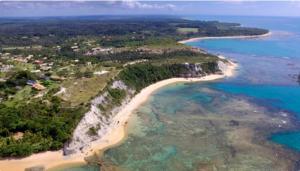 an aerial view of a beach and the ocean at Casa do cajueiro in Praia do Espelho