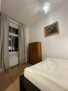 Posteľ alebo postele v izbe v ubytovaní BISCHOFSBERG Gdańsk City Center Apartments