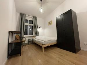 Posteľ alebo postele v izbe v ubytovaní BISCHOFSBERG Gdańsk City Center Apartments