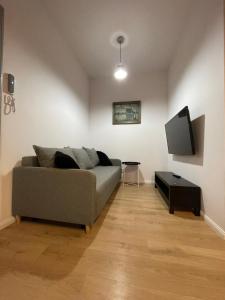 Televízia a/alebo spoločenská miestnosť v ubytovaní BISCHOFSBERG Gdańsk City Center Apartments