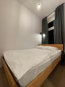 Posteľ alebo postele v izbe v ubytovaní BISCHOFSBERG Gdańsk City Center Apartments