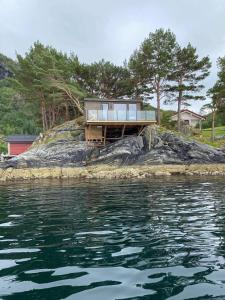 a house on an island in the water at Ocean View Stad in Barmen