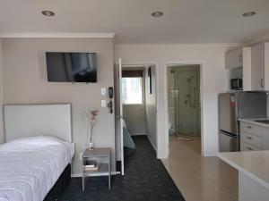 Postel nebo postele na pokoji v ubytování Phoenix Palm Motel