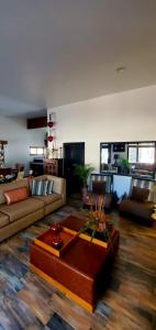 a living room with a couch and a coffee table at Casa Emiliana in Valle de Guadalupe