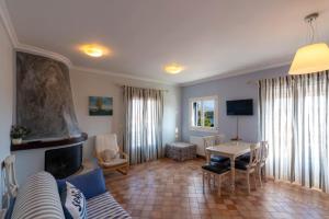a living room with a couch and a table at Nautilus Luxury Suites in Galaxidi