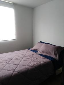 Tempat tidur dalam kamar di Apartamento Colina, Campestre Suba