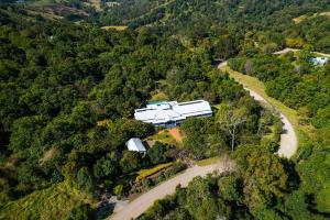 an aerial view of a house in the middle of a forest at The Country House at Hunchy Montville in Montville