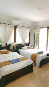Krevet ili kreveti u jedinici u okviru objekta Villa Dende Lombok