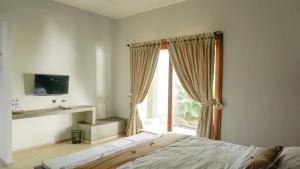 Postel nebo postele na pokoji v ubytování Villa Dende Lombok